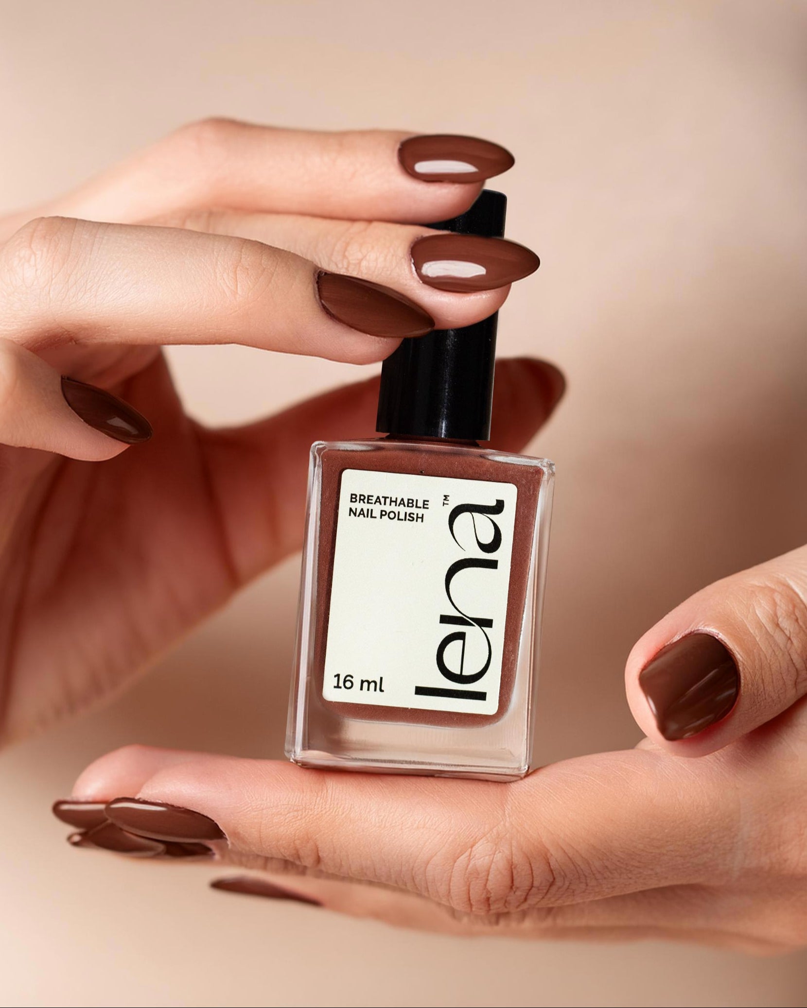 Muslim women showing breathable halal nail polish in brown colour
